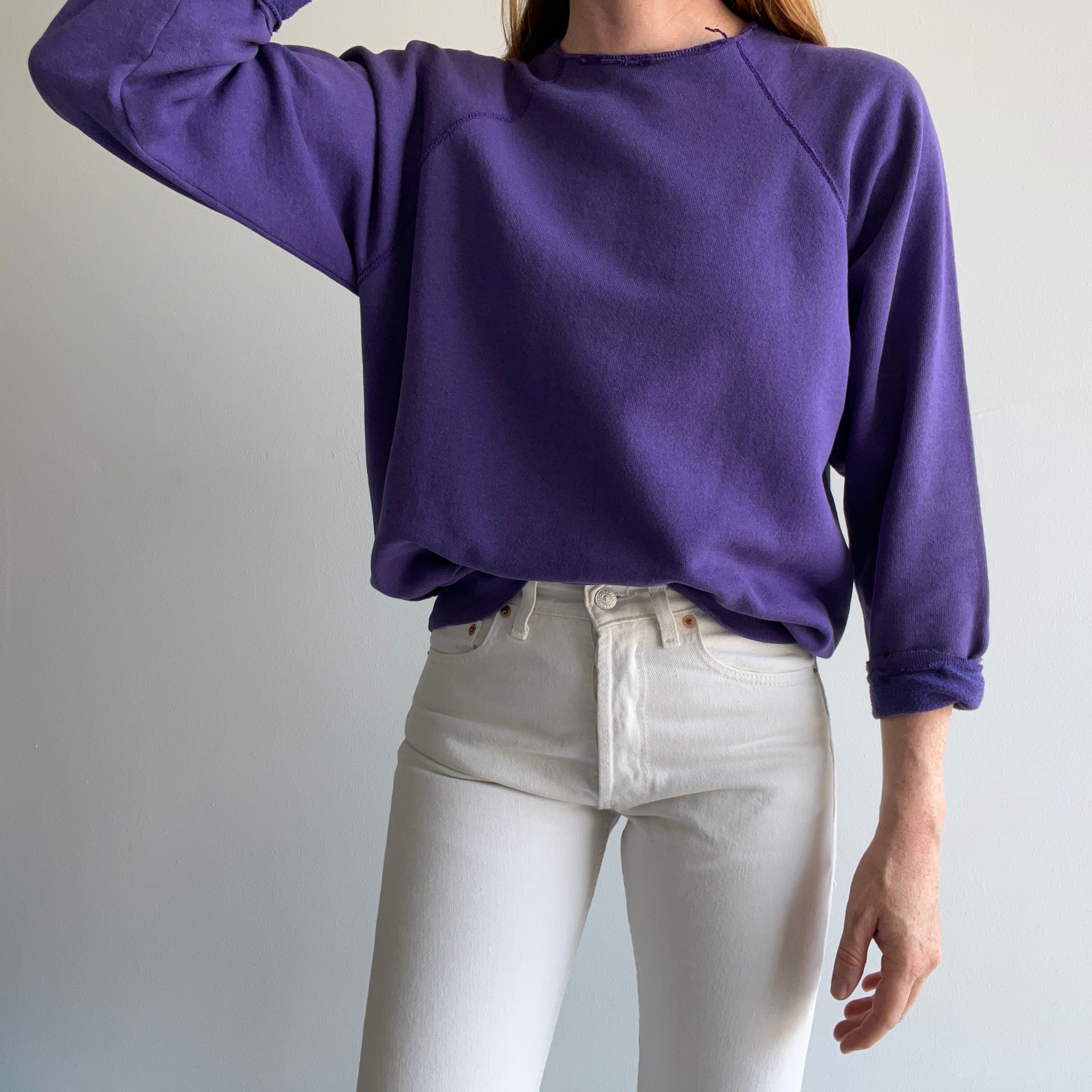 1980s Cut Collar and Cuffs Faded and Worn Purple Raglan Sweatshirt