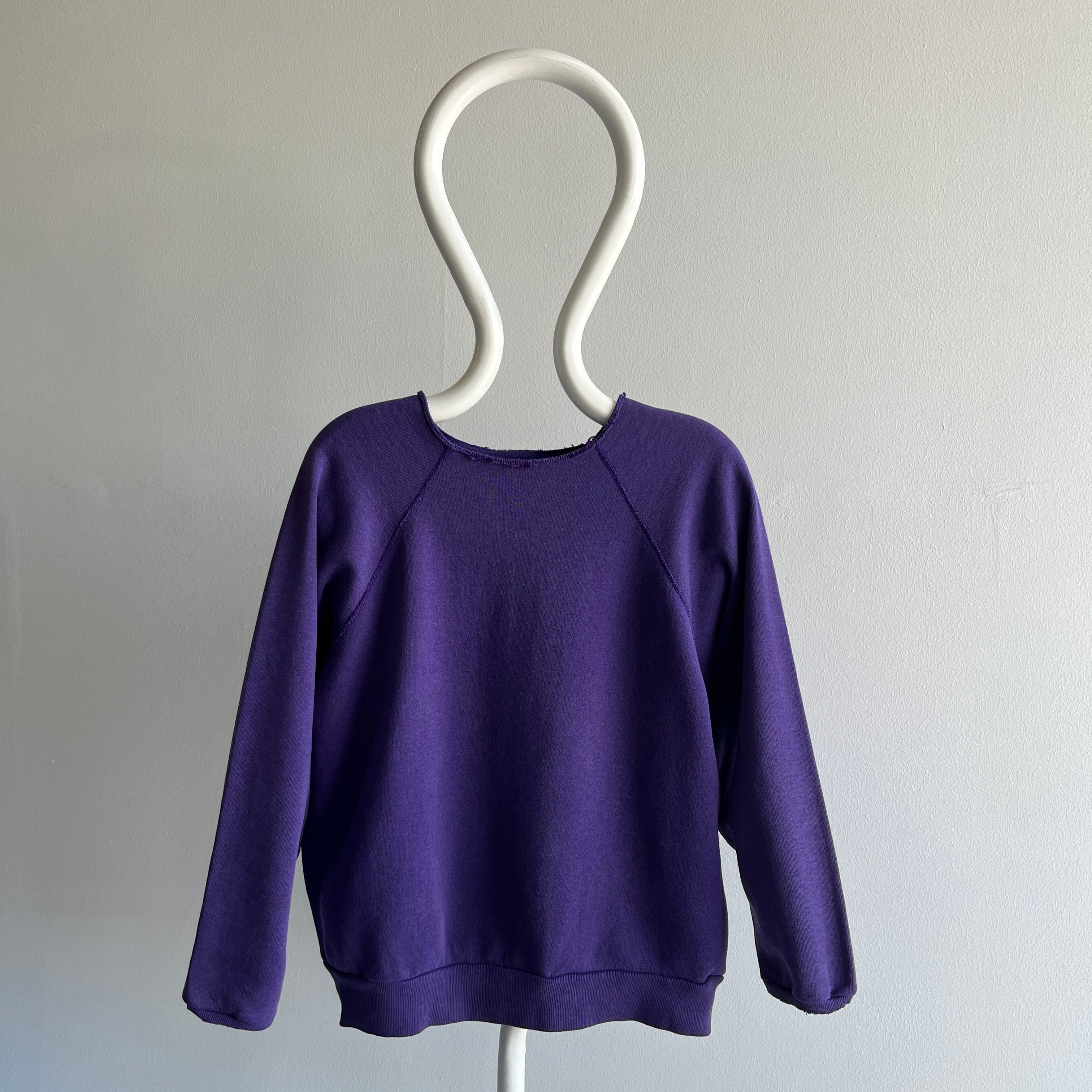 1980s Cut Collar and Cuffs Faded and Worn Purple Raglan Sweatshirt