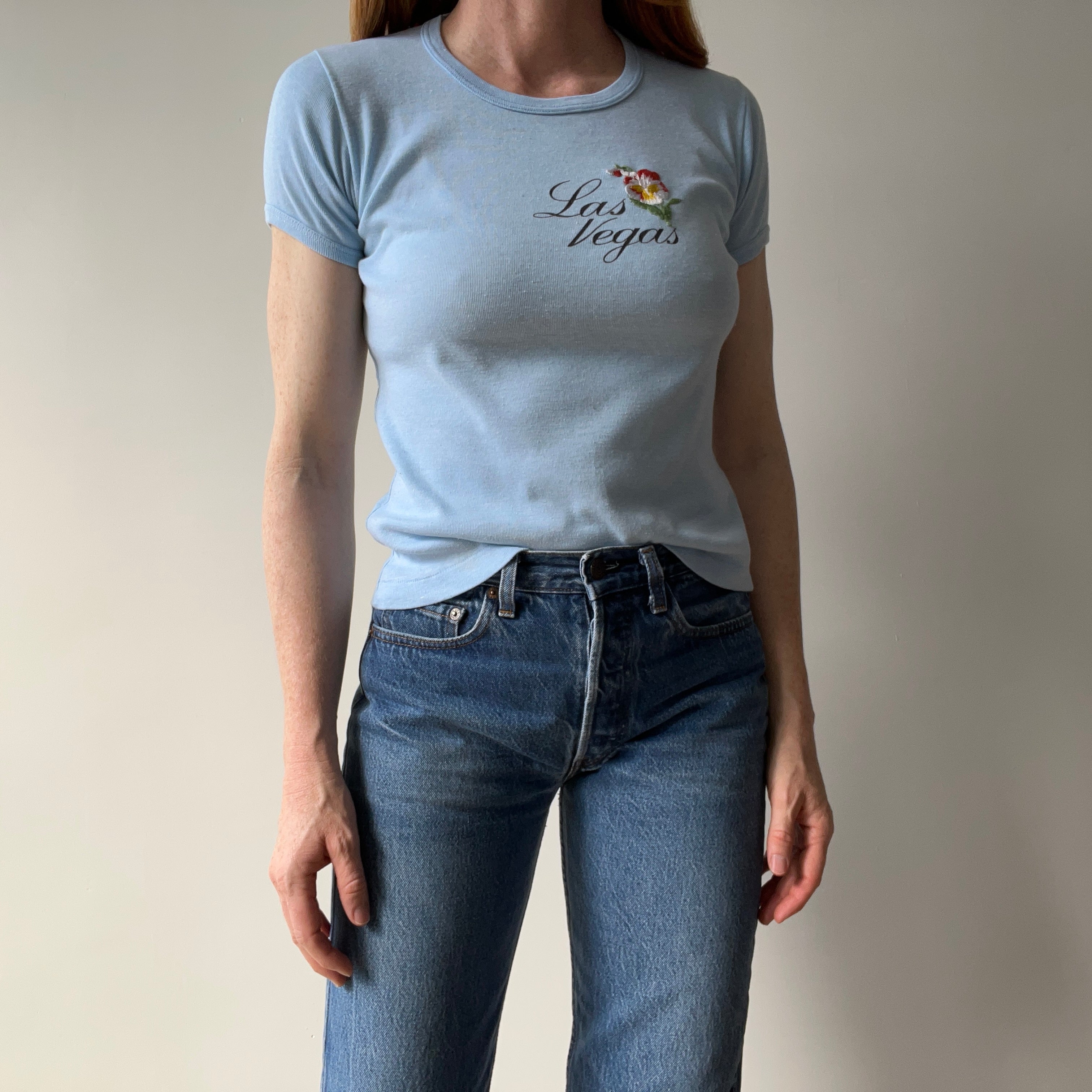 1970s Las Vegas Baby Tee with Embroidered Flower Patch and Faint Arm Pit Stains