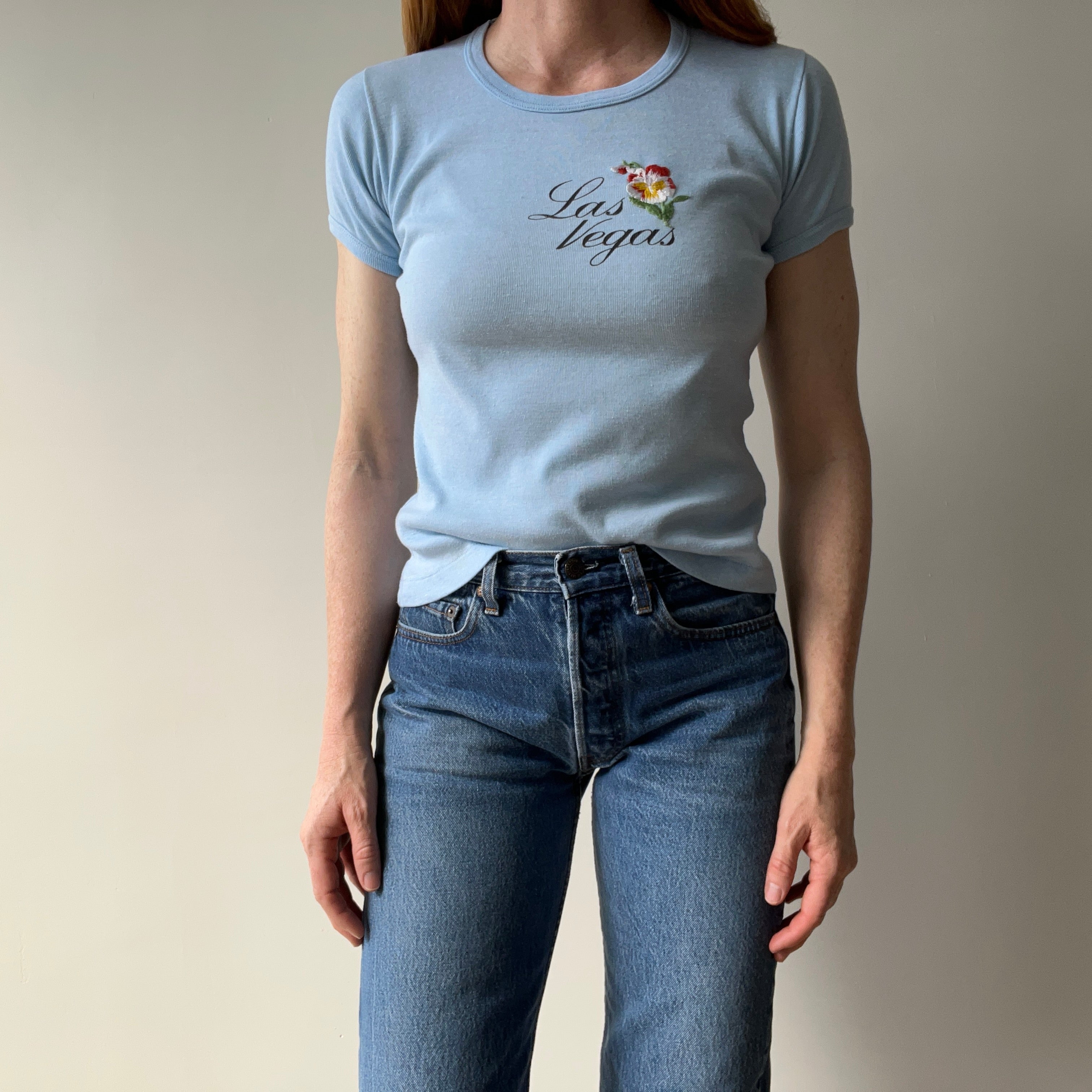 1970s Las Vegas Baby Tee with Embroidered Flower Patch and Faint Arm Pit Stains