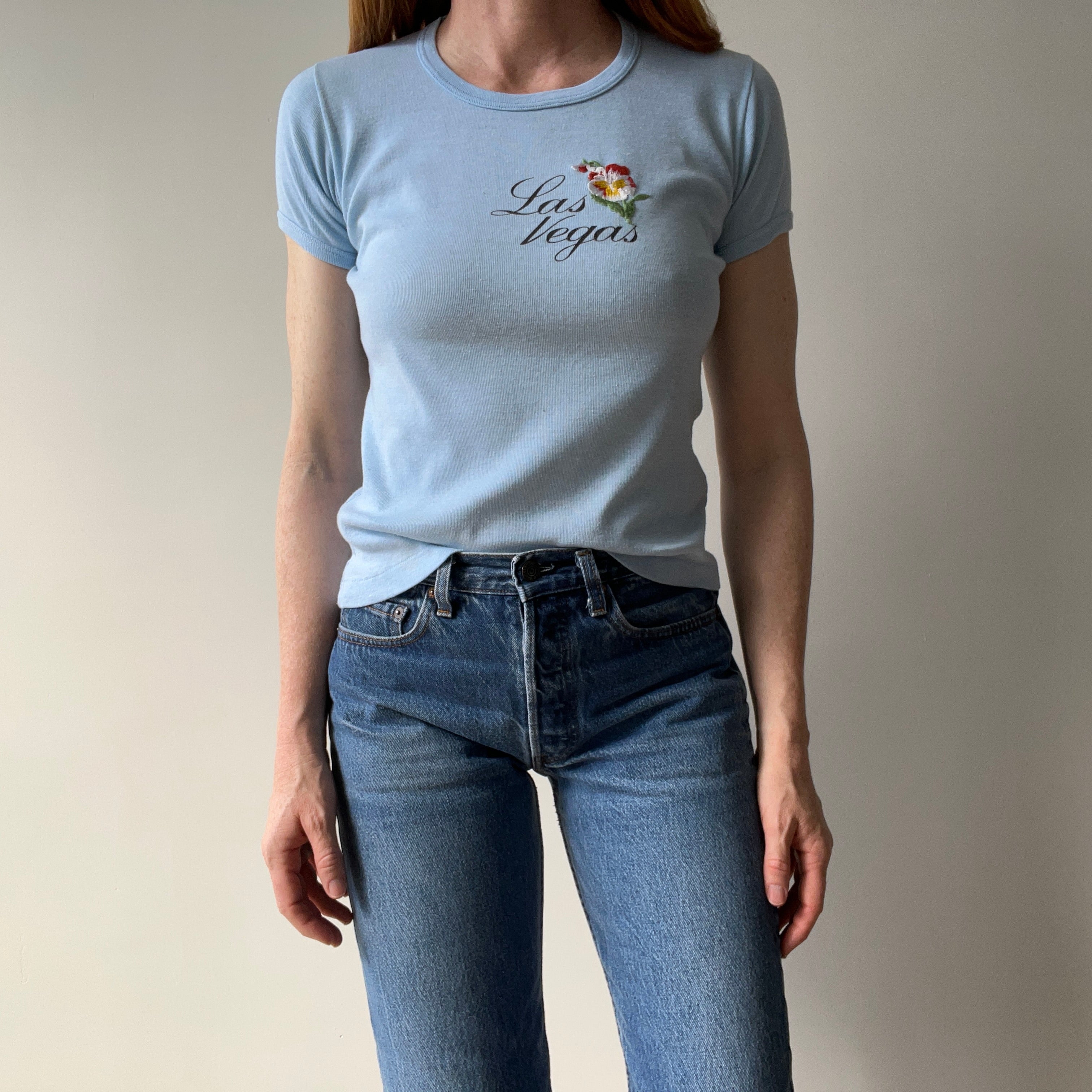 1970s Las Vegas Baby Tee with Embroidered Flower Patch and Faint Arm Pit Stains