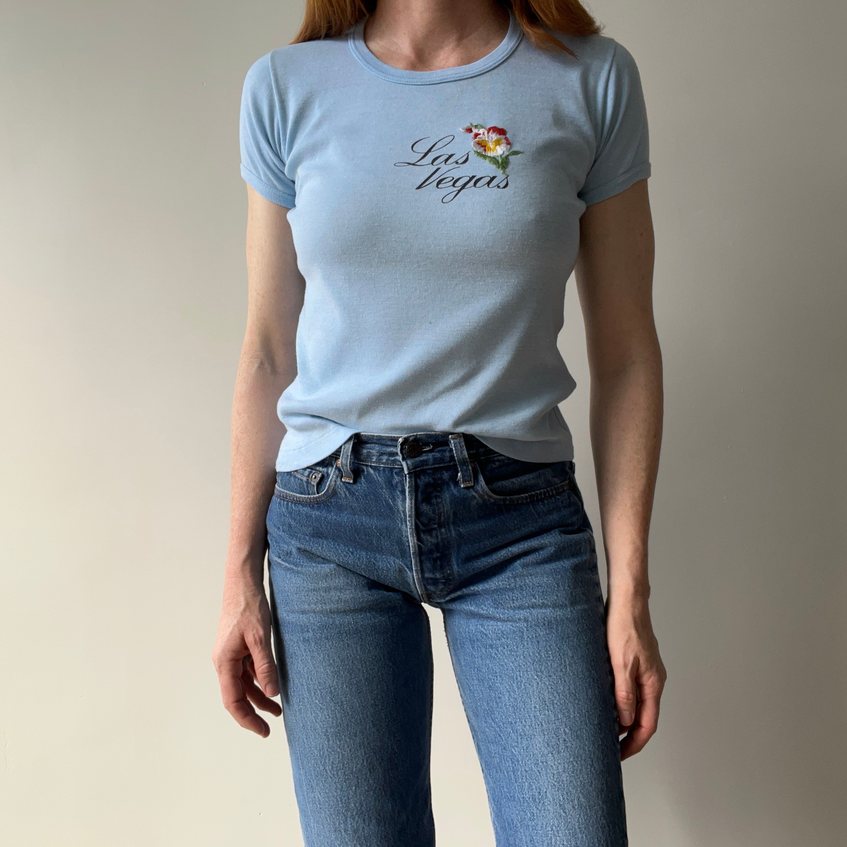 1970s Las Vegas Baby Tee with Embroidered Flower Patch and Faint Arm Pit Stains