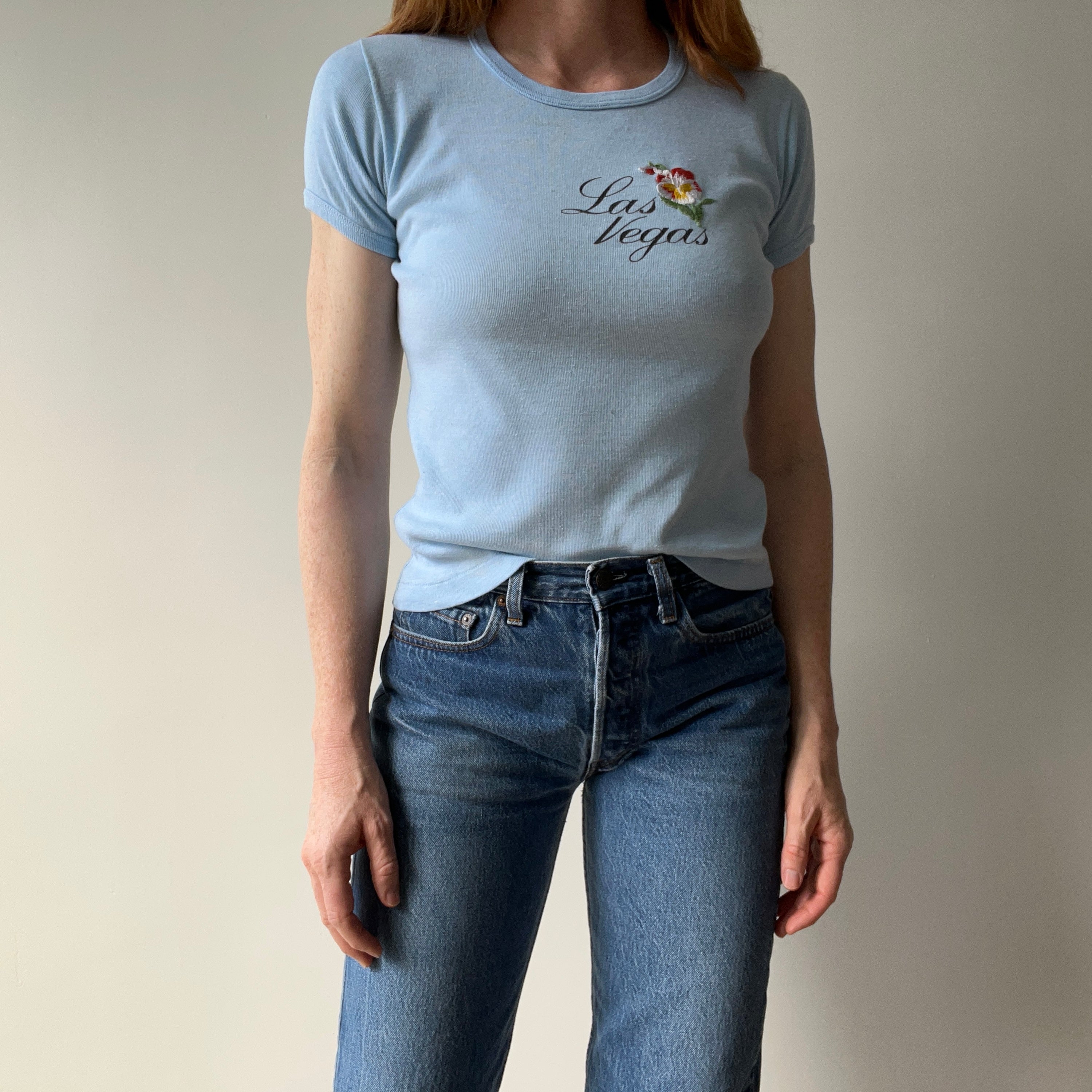 1970s Las Vegas Baby Tee with Embroidered Flower Patch and Faint Arm Pit Stains