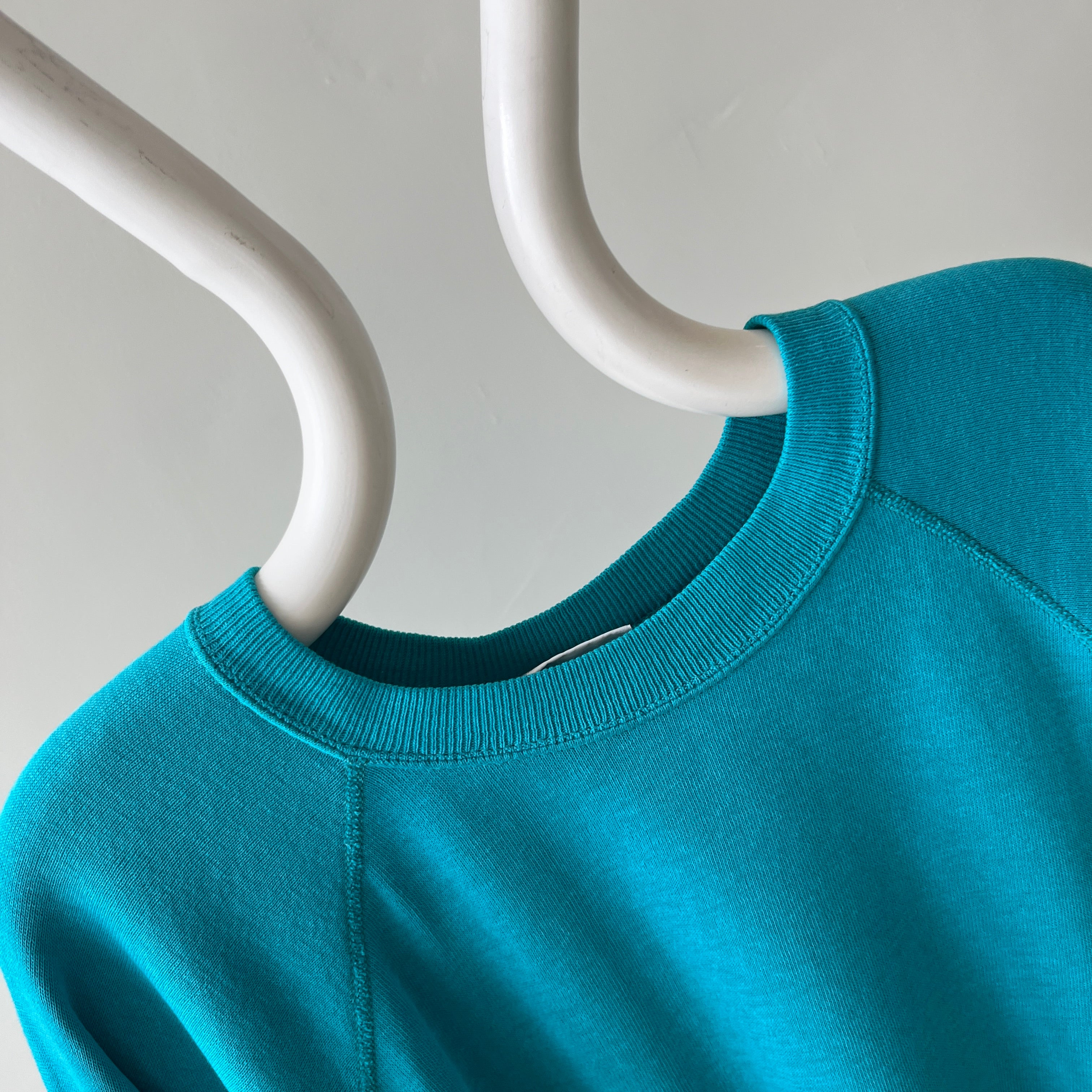 1980s Turquoise Super Thinned Out and Slouchy Blank Raglan by Bassett Walker