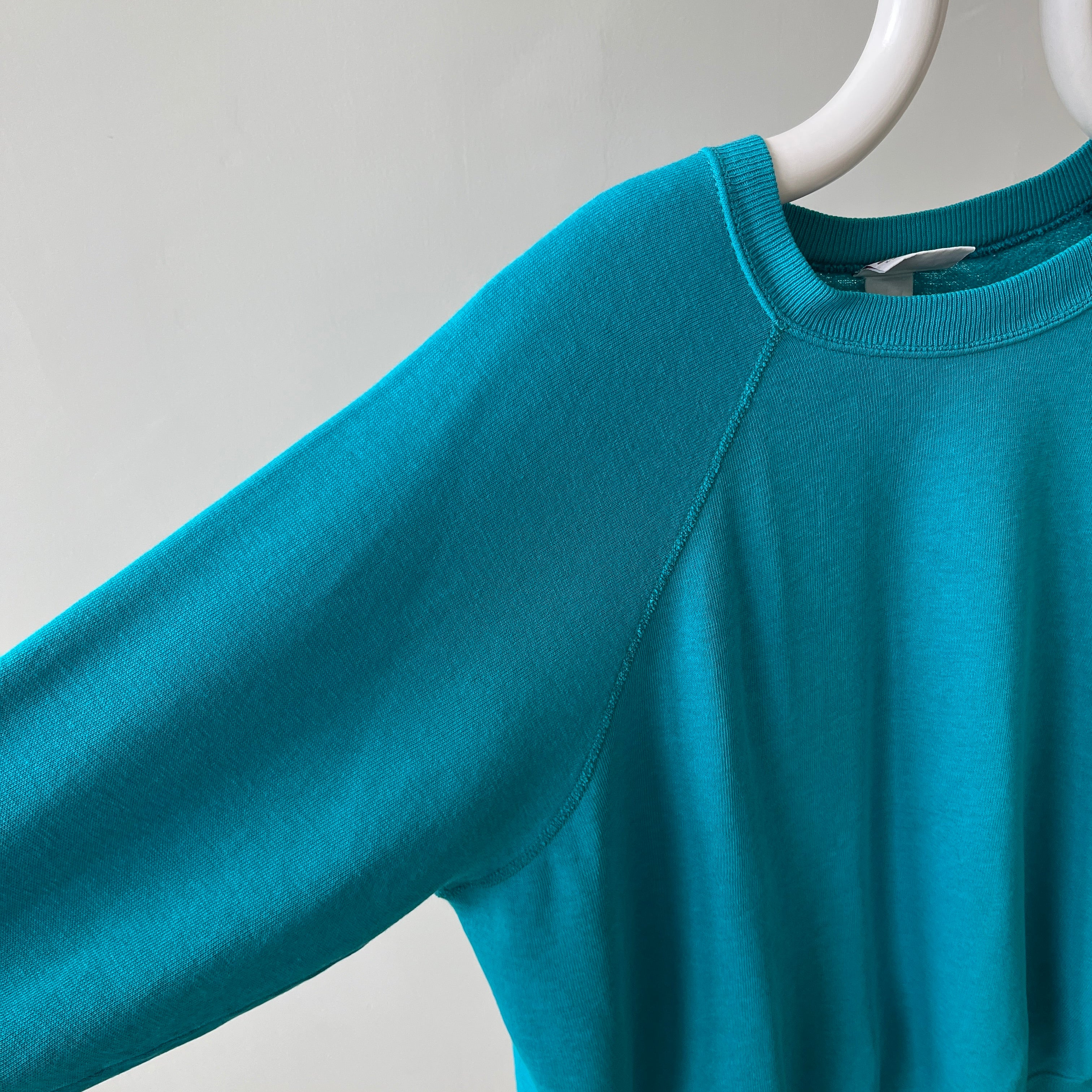 1980s Turquoise Super Thinned Out and Slouchy Blank Raglan by Bassett Walker