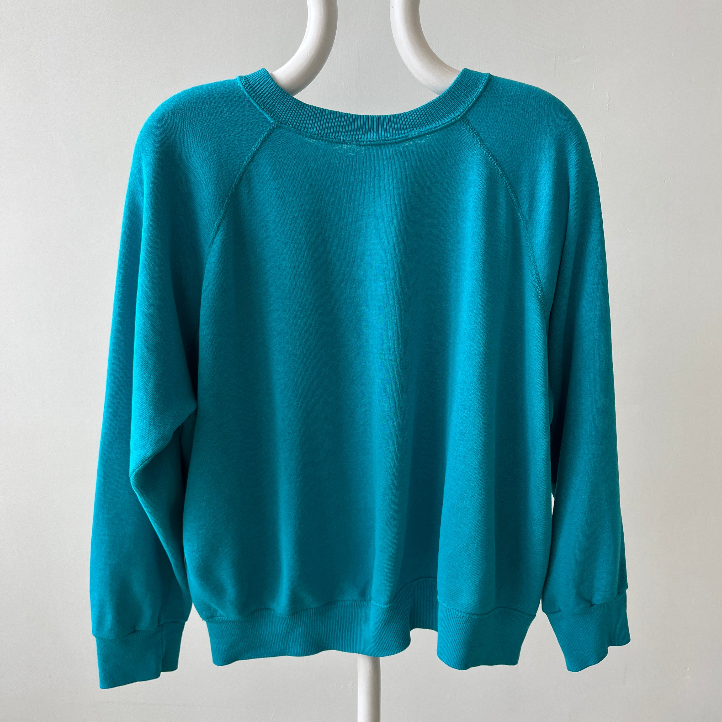 1980s Turquoise Super Thinned Out and Slouchy Blank Raglan by Bassett Walker