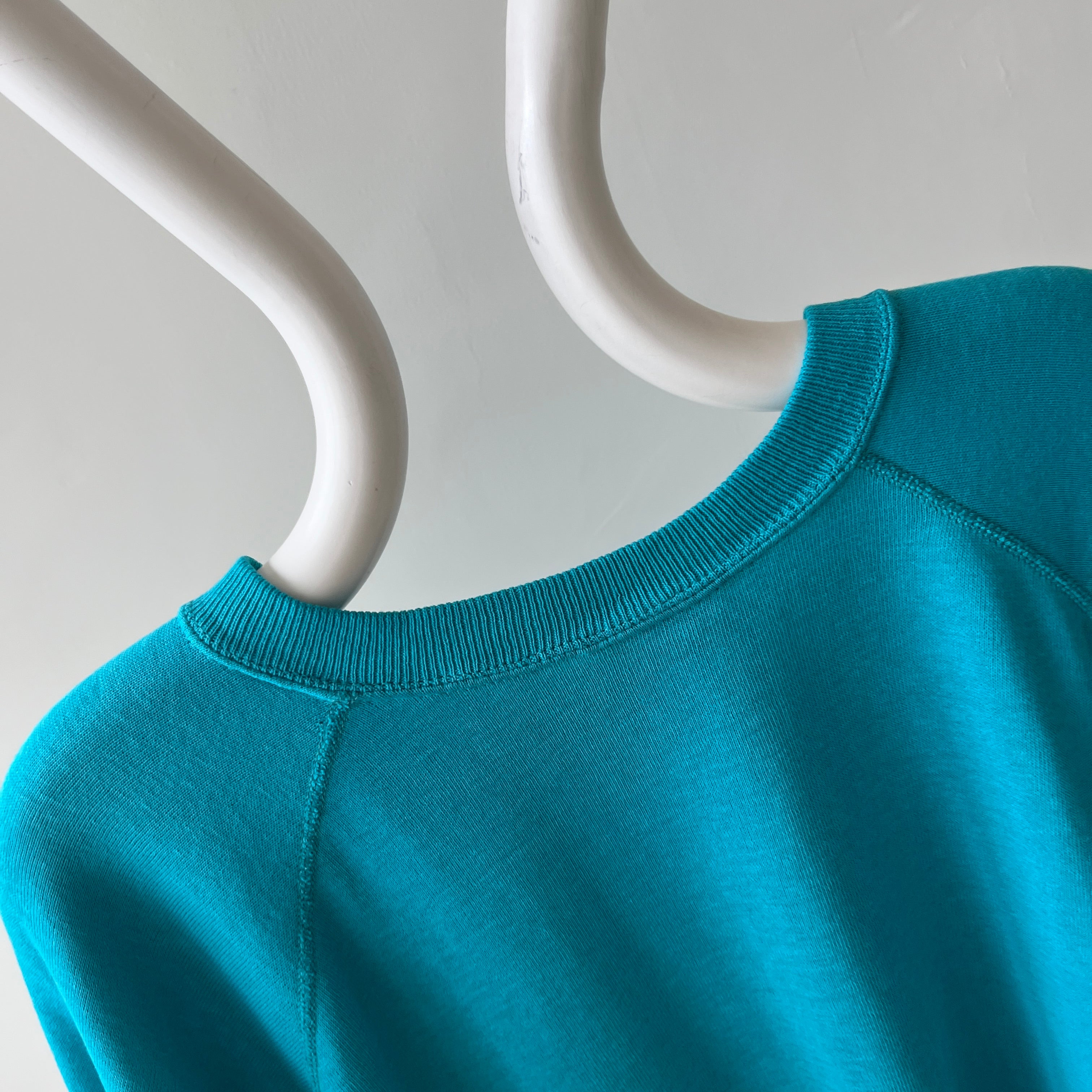 1980s Turquoise Super Thinned Out and Slouchy Blank Raglan by Bassett Walker