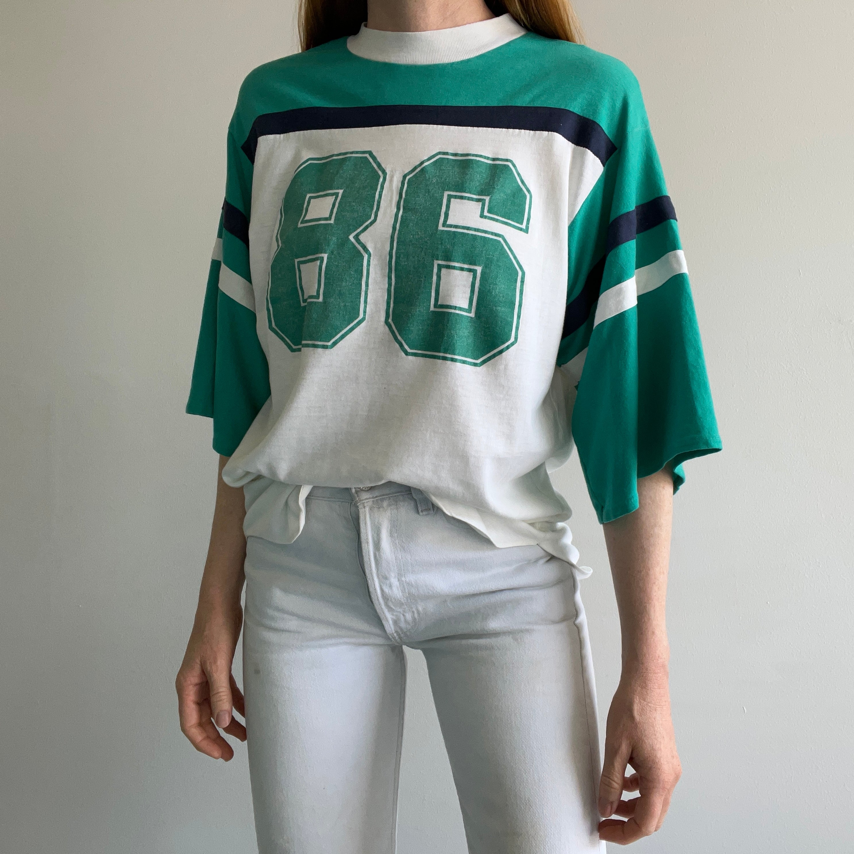 1986 Very Slouchy and Thin Football T-Shirt with XL Sleeves