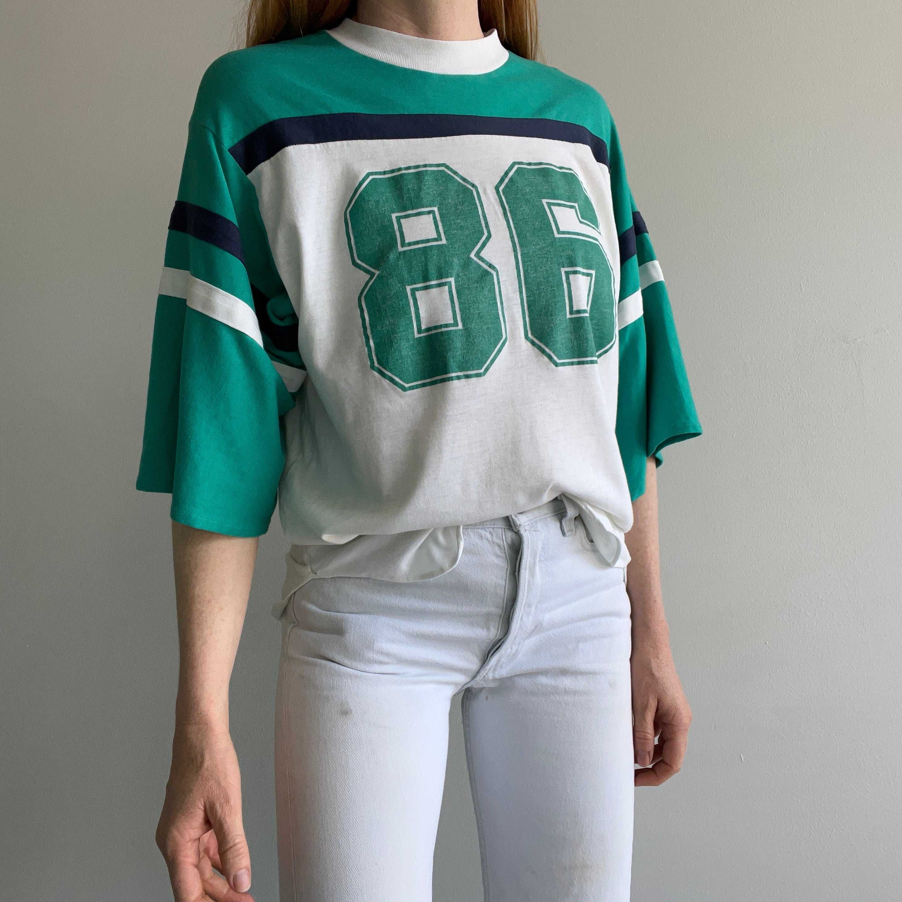 1986 Very Slouchy and Thin Football T-Shirt with XL Sleeves