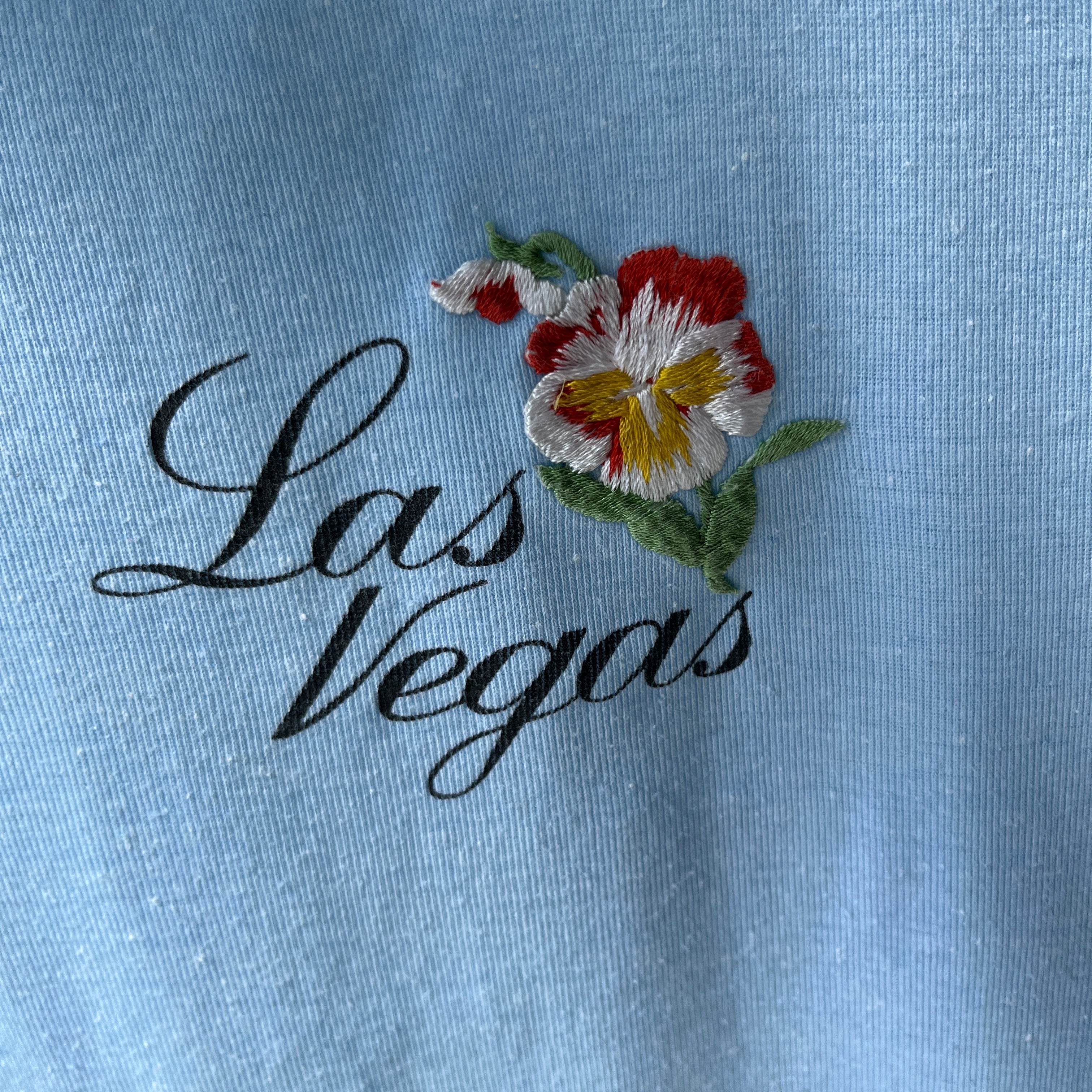 1970s Las Vegas Baby Tee with Embroidered Flower Patch and Faint Arm Pit Stains