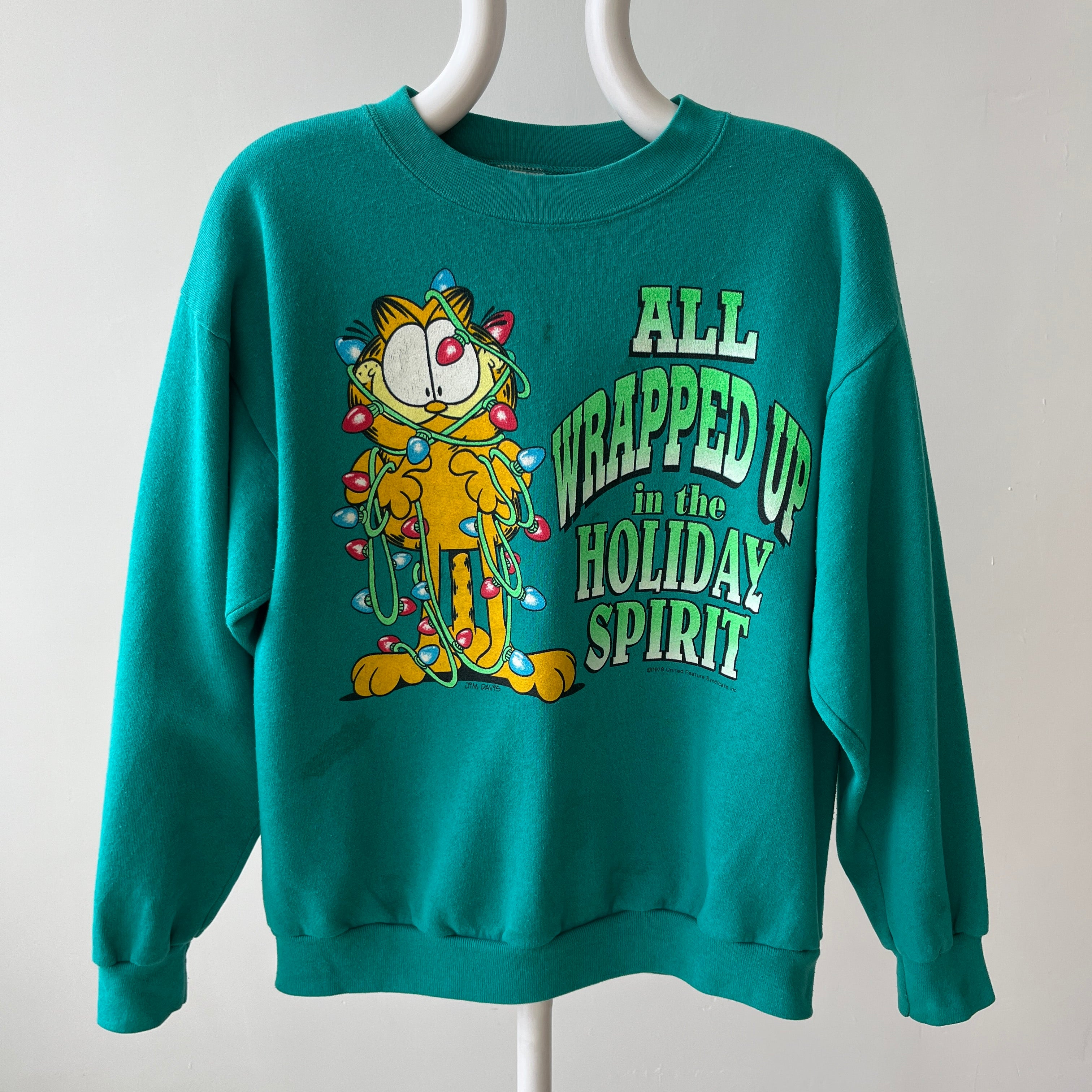 1980/90s All Wrapped Up in the Holiday Spirit - Garfield Sweatshirt - Staining