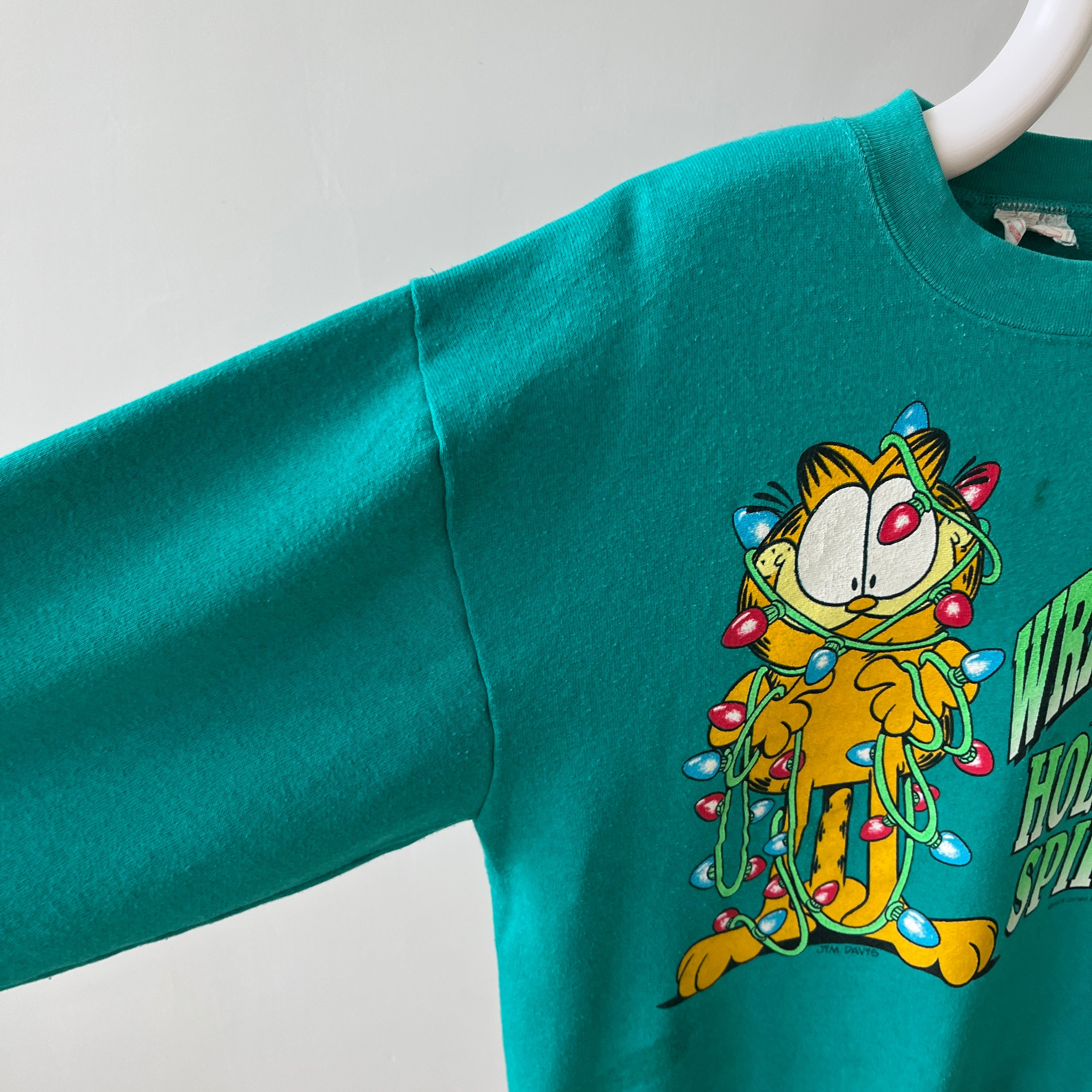 1980/90s All Wrapped Up in the Holiday Spirit - Garfield Sweatshirt - Staining