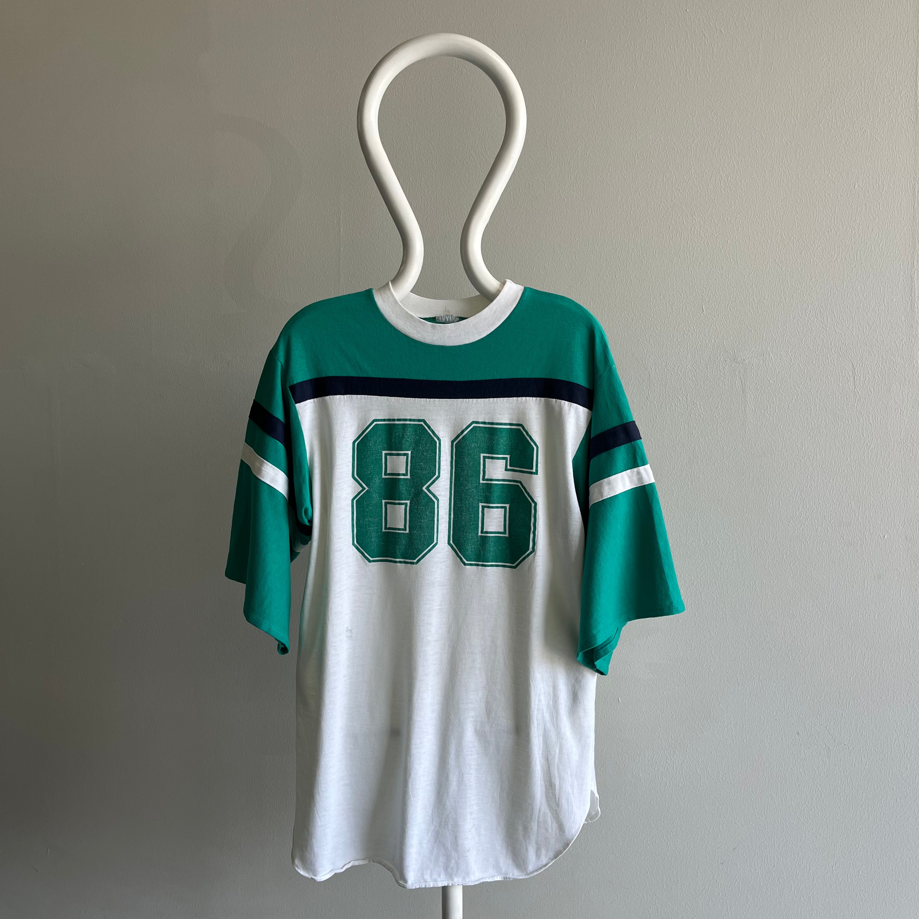 1986 Very Slouchy and Thin Football T-Shirt with XL Sleeves