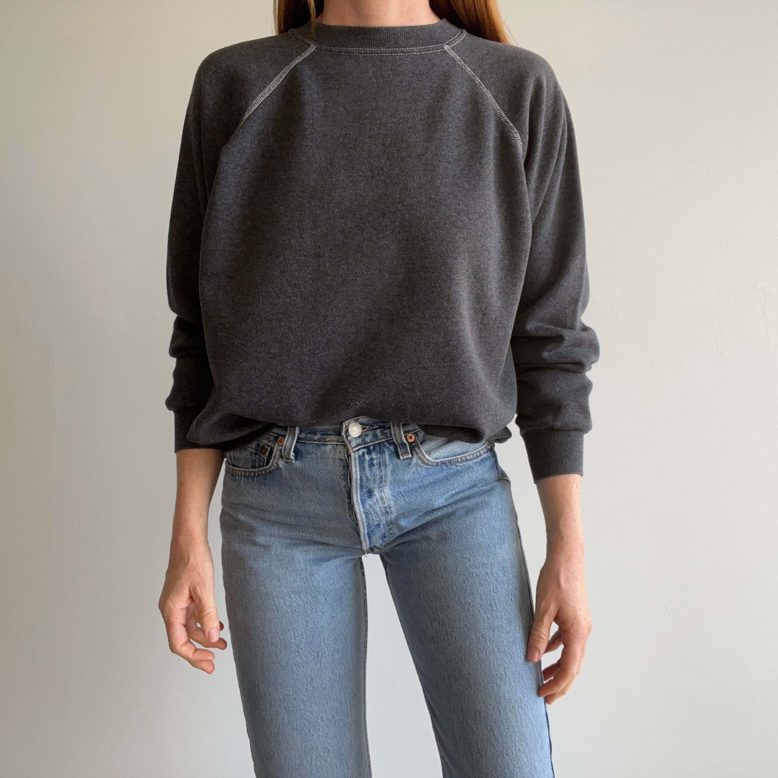 1980s Re Dyded Deep Gray Hanes Her Way Raglan Sweatshirt with White Contrast Stitching.