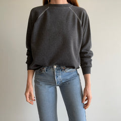 1980s Re Dyded Deep Gray Hanes Her Way Raglan Sweatshirt with White Contrast Stitching.