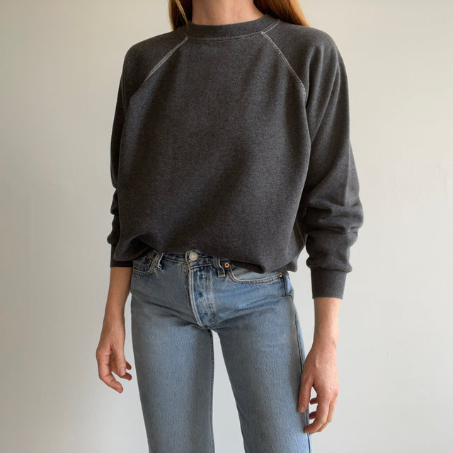 1980s Re Dyded Deep Gray Hanes Her Way Raglan Sweatshirt with White Contrast Stitching.