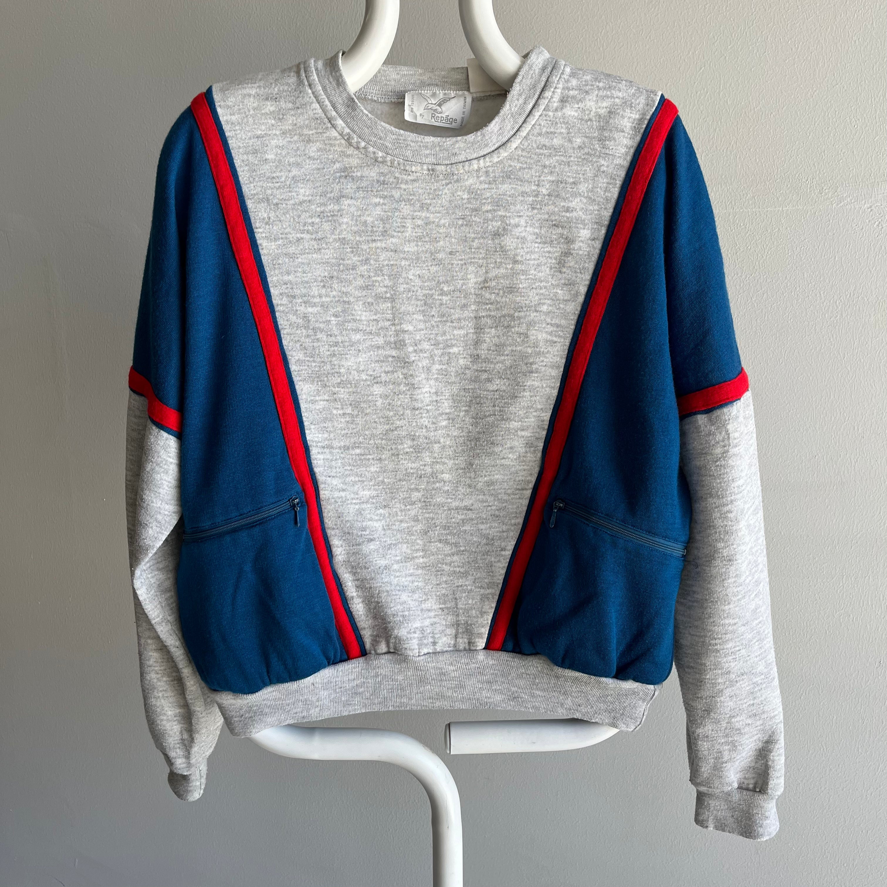 Sweat-shirt color block rouge, gris et bleu des années 1980 avec poches zippées